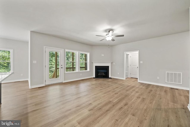 150 Holly Ct, Mineral, VA 23117 - unfurnished living room with ceiling fan, a fireplace with flush hearth, baseboards, and light wood-style flooring
