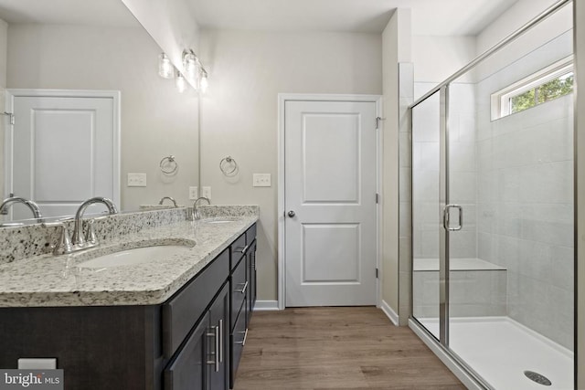150 Holly Ct, Mineral, VA 23117 - bathroom with a stall shower, wood finished floors, double vanity, and baseboards