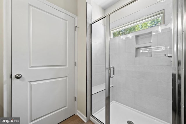 150 Holly Ct, Mineral, VA 23117 - bathroom with a stall shower and wood finished floors