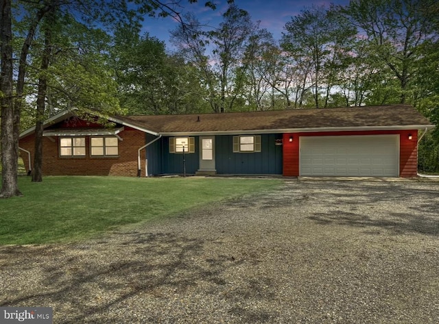 view of front of house with board and batten siding, a garage, driveway, and a front yard