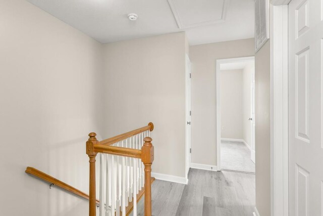2890 Crystal Spring Ln, Rockingham, VA 22801 - hall featuring an upstairs landing, wood finished floors, and baseboards