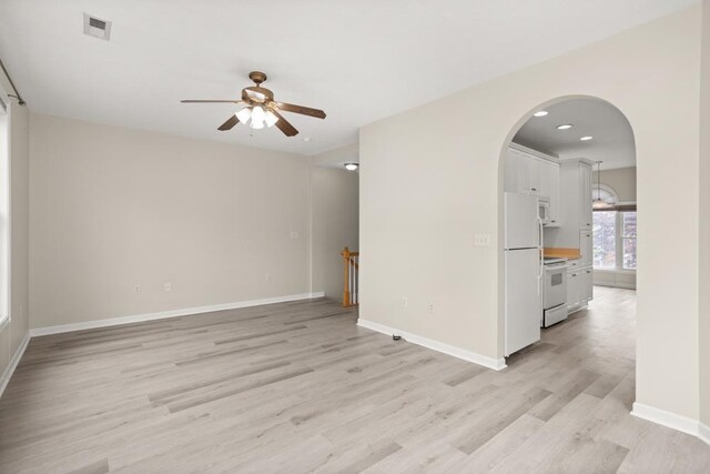 2890 Crystal Spring Ln, Rockingham, VA 22801 - unfurnished room with a ceiling fan, light wood-type flooring, baseboards, arched walkways, and recessed lighting