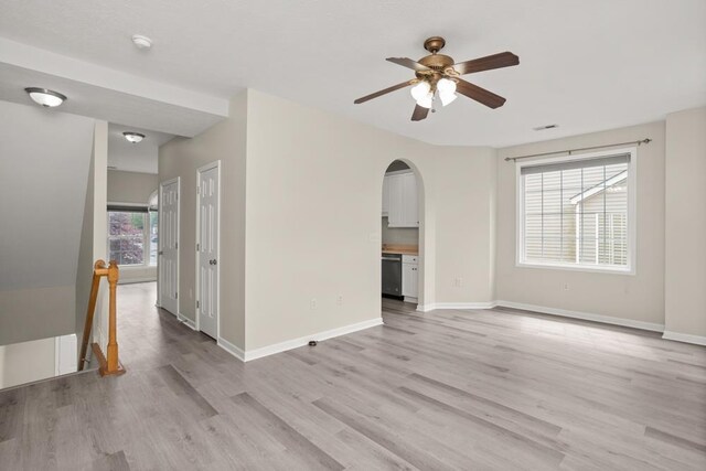 2890 Crystal Spring Ln, Rockingham, VA 22801 - unfurnished room featuring arched walkways, ceiling fan, light wood-style flooring, baseboards, and a smoke detector