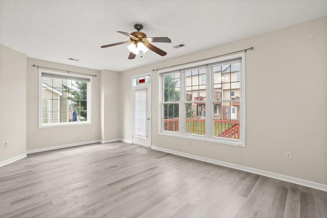 2890 Crystal Spring Ln, Rockingham, VA 22801 - unfurnished room with wood finished floors, a ceiling fan, and baseboards