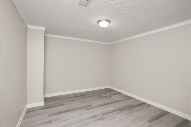 2890 Crystal Spring Ln, Rockingham, VA 22801 - spare room with wood finished floors, ornamental molding, baseboards, and a textured ceiling