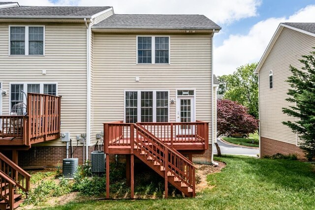 2890 Crystal Spring Ln, Rockingham, VA 22801 - back of property with stairs, a deck, a yard, and central AC