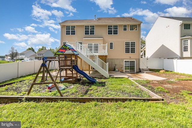 6224 Hot Spring Ln, Fredericksburg, VA 22407 - rear view of property featuring a playground, a fenced backyard, stairway, and a wooden deck