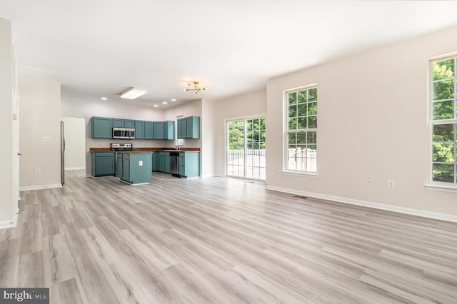6224 Hot Spring Ln, Fredericksburg, VA 22407 - unfurnished living room featuring healthy amount of natural light, light wood finished floors, and recessed lighting
