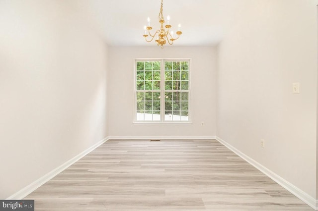 6224 Hot Spring Ln, Fredericksburg, VA 22407 - empty room featuring a chandelier and light wood-style floors