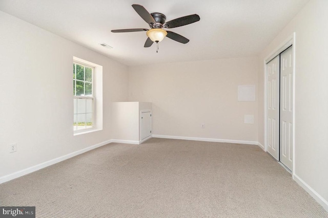 6224 Hot Spring Ln, Fredericksburg, VA 22407 - unfurnished bedroom featuring light colored carpet, a closet, and a ceiling fan