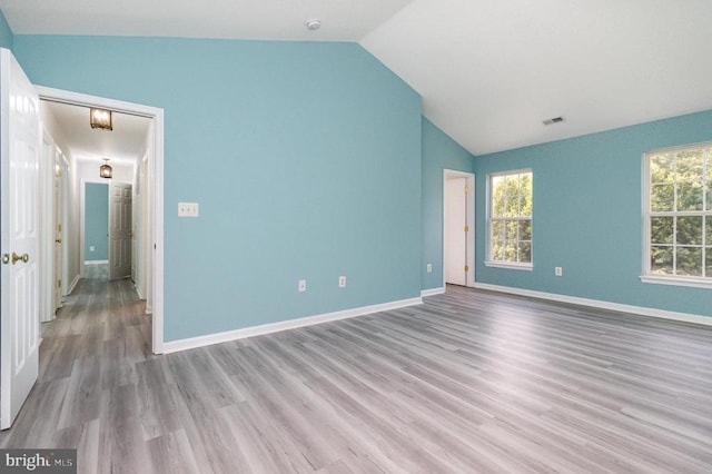 6224 Hot Spring Ln, Fredericksburg, VA 22407 - spare room with lofted ceiling and light wood-style flooring