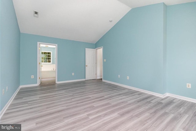 6224 Hot Spring Ln, Fredericksburg, VA 22407 - unfurnished bedroom with lofted ceiling, light wood-style flooring, and connected bathroom