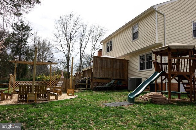 view of play area with cooling unit and a wooden deck