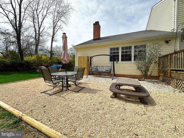 view of patio featuring outdoor dining area