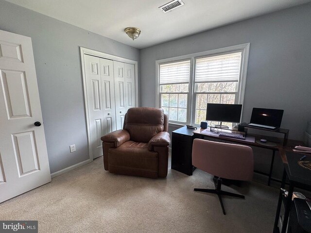 home office with carpet floors and baseboards