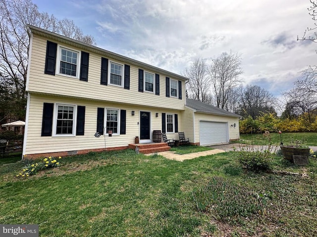 colonial home with a garage, a front yard, driveway, and crawl space