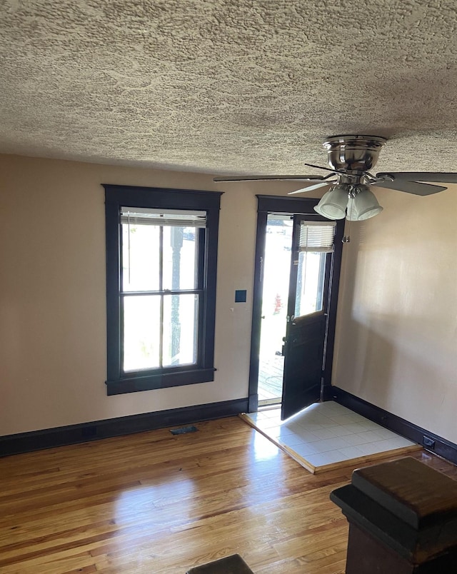 373 S Magnolia Ave S, Waynesboro, VA 22980 - entryway with wood finished floors, a textured ceiling, visible vents, baseboards, and ceiling fan