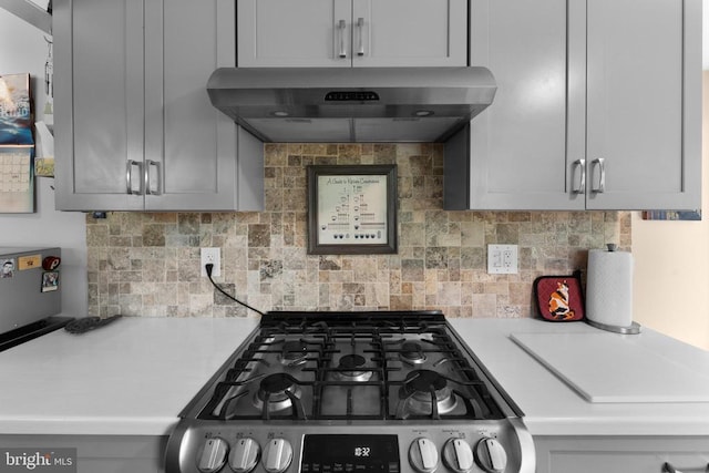 27478 Old Office Rd, Culpeper, VA 22701 - kitchen featuring stainless steel gas range oven, wall chimney exhaust hood, light countertops, and tasteful backsplash