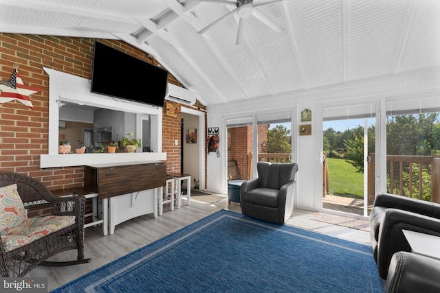 27478 Old Office Rd, Culpeper, VA 22701 - living room with brick wall, a wall mounted air conditioner, ceiling fan, and wood finished floors