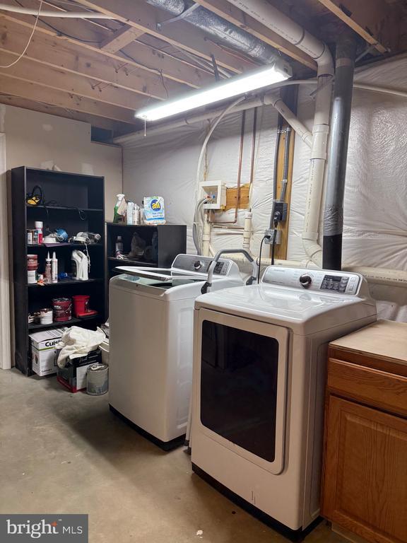 273 Pettit Pl, Louisa, VA 23093 - washroom featuring washer and dryer and cabinet space