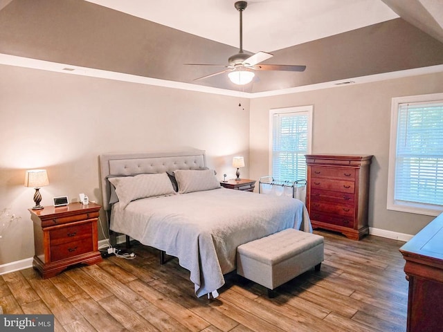  - bedroom featuring wood finished floors and a ceiling fan