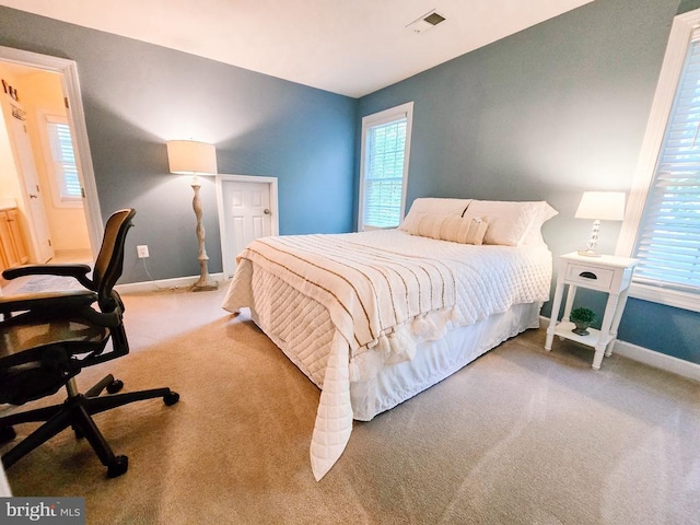  - carpeted bedroom featuring baseboards and a desk