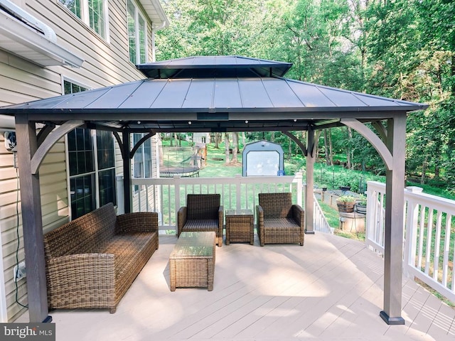  - view of patio with a gazebo, a shed, a deck, and an outdoor living space