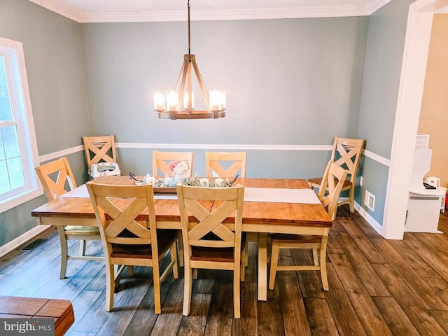  - dining space with wood finished floors, a chandelier, and crown molding