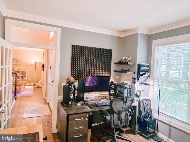  - home office featuring wood finished floors and crown molding