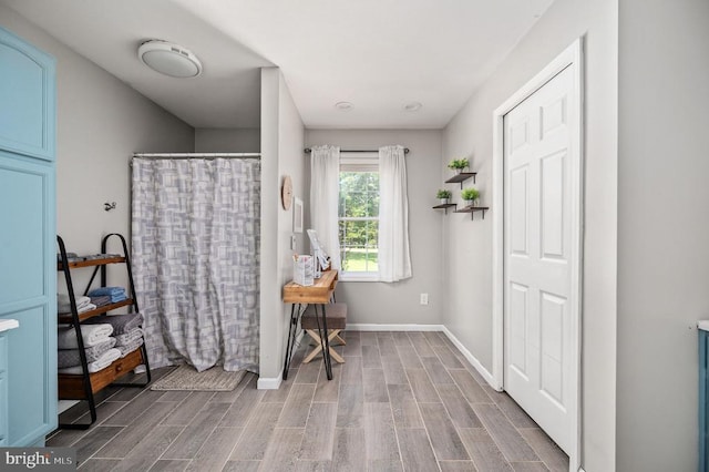 108 Shannon Glen Ct, Louisa, VA 23093 - full bathroom featuring wood finished floors and a shower with curtain