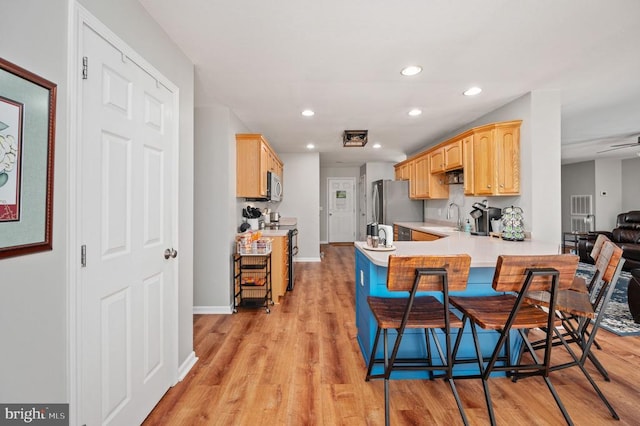 108 Shannon Glen Ct, Louisa, VA 23093 - kitchen with appliances with stainless steel finishes, light brown cabinets, light wood-style floors, and recessed lighting