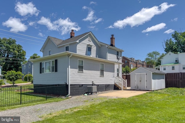 63 Madison St, Warrenton, VA 20186 - back of house with a storage shed, a chimney, and a patio