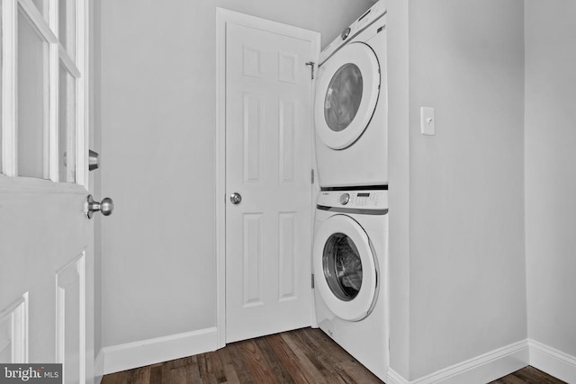 63 Madison St, Warrenton, VA 20186 - laundry room featuring stacked washer and clothes dryer and dark wood-style flooring