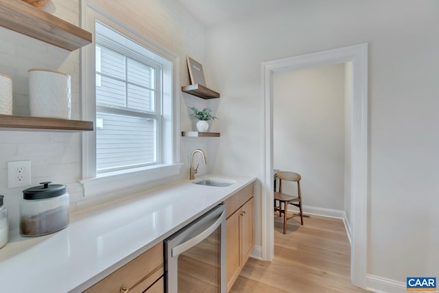 kitchen with wine cooler, light brown cabinetry, a sink, open shelves, and light wood-style floors