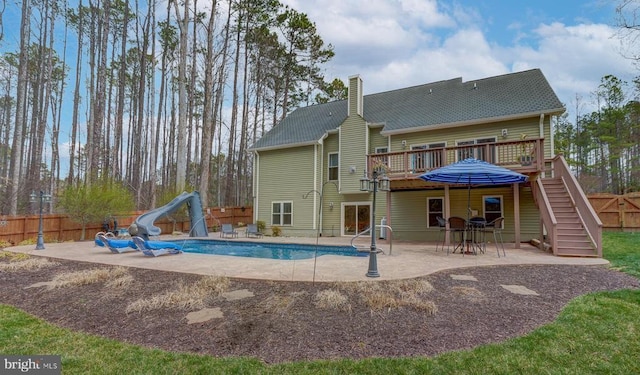 11304 Piney Forest Dr, Bumpass, VA 23024 - rear view of property with a deck, a fenced backyard, stairway, a patio area, and a chimney