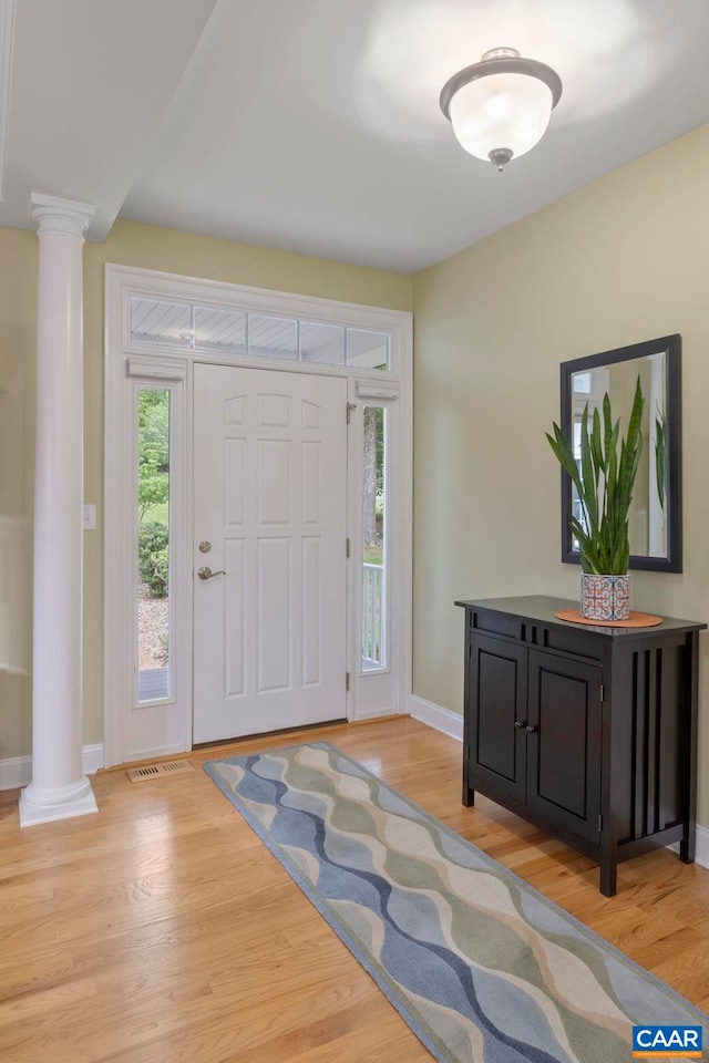 143 Chapel Ct, Palmyra, VA 22963 - entryway featuring decorative columns, light wood finished floors, and baseboards