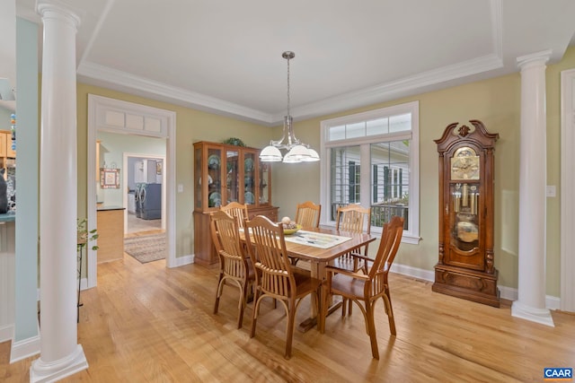 143 Chapel Ct, Palmyra, VA 22963 - dining area with decorative columns, light wood-style flooring, baseboards, crown molding, and washer / clothes dryer
