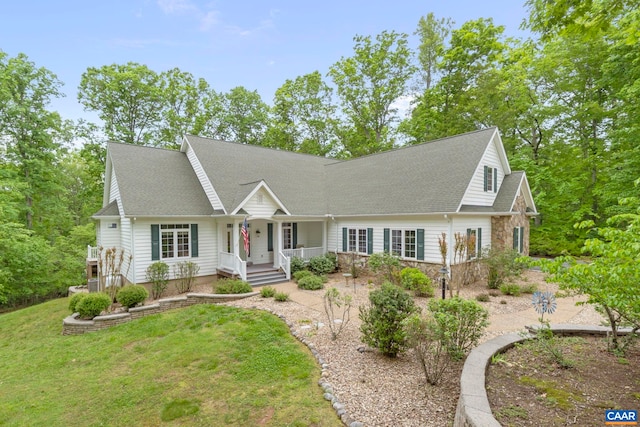 143 Chapel Ct, Palmyra, VA 22963 - cape cod home featuring a porch, stone siding, a front yard, and roof with shingles