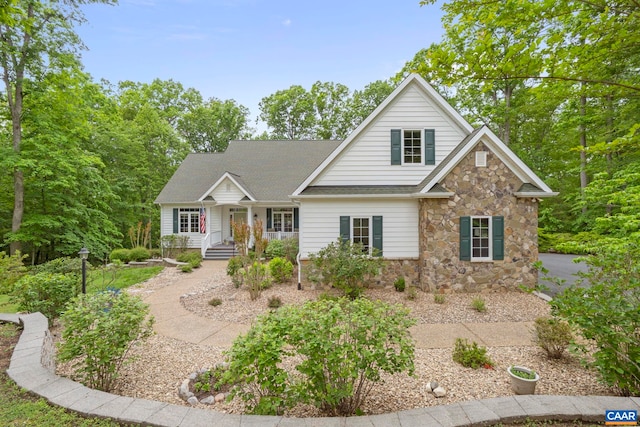 143 Chapel Ct, Palmyra, VA 22963 - traditional-style house with stone siding, a porch, and a shingled roof
