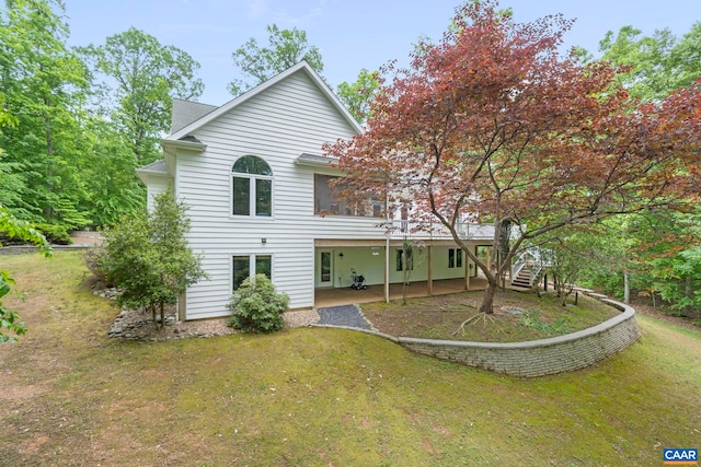 143 Chapel Ct, Palmyra, VA 22963 - rear view of property with a patio area, a lawn, and stairway