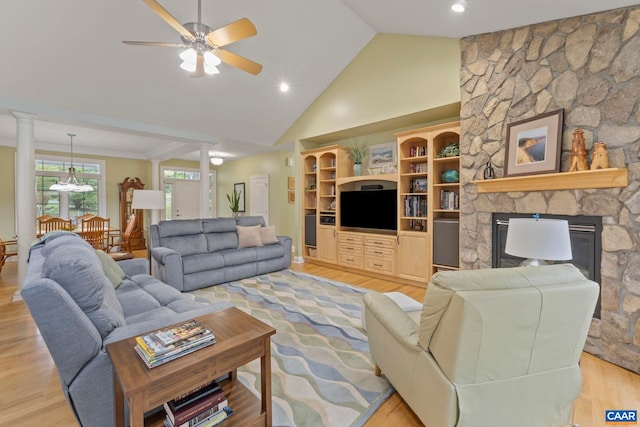 143 Chapel Ct, Palmyra, VA 22963 - living area featuring light wood-type flooring, a stone fireplace, ceiling fan, decorative columns, and recessed lighting