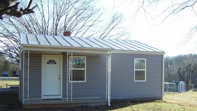17156 Red Brush Rd, Elkton, VA 22827 - exterior space with a chimney, an outbuilding, a standing seam roof, metal roof, and central AC unit