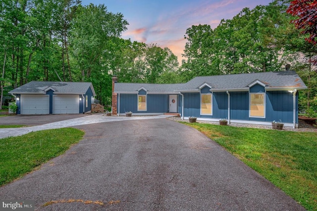 141 Eagle Ct, Locust Grove, VA 22508 - ranch-style home featuring an outdoor structure, a garage, a front lawn, and a chimney