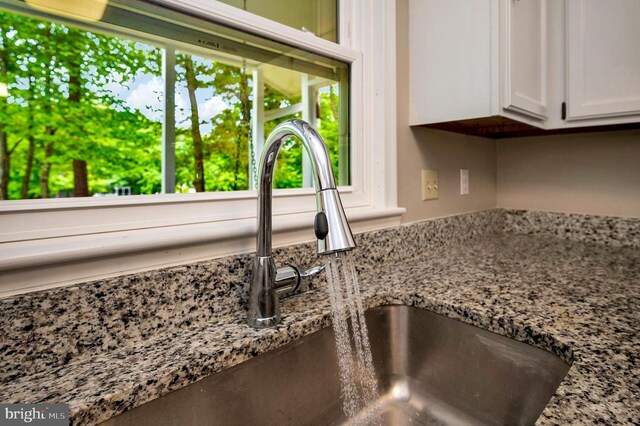 141 Eagle Ct, Locust Grove, VA 22508 - kitchen view of white cabinetry and light stone counters