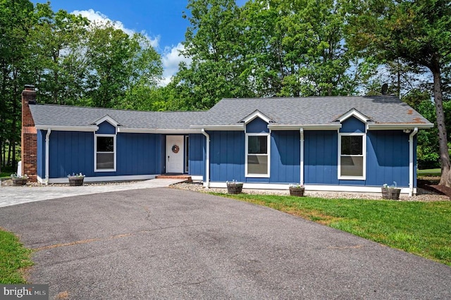 141 Eagle Ct, Locust Grove, VA 22508 - ranch-style house with a chimney, board and batten siding, driveway, and a shingled roof