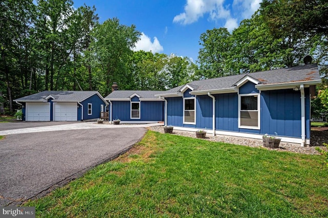 141 Eagle Ct, Locust Grove, VA 22508 - single story home featuring a detached garage, an outdoor structure, a front yard, and board and batten siding