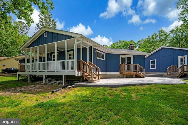 141 Eagle Ct, Locust Grove, VA 22508 - rear view of house with a patio area, a yard, a deck, and a chimney