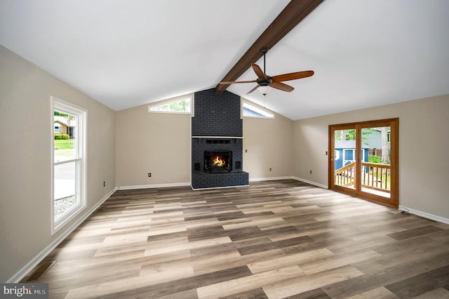 141 Eagle Ct, Locust Grove, VA 22508 - unfurnished living room featuring a ceiling fan, a fireplace, wood finished floors, and healthy amount of natural light