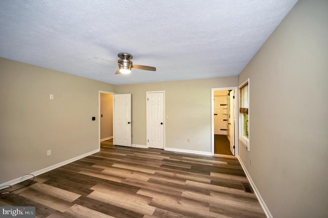 141 Eagle Ct, Locust Grove, VA 22508 - unfurnished bedroom with baseboards, wood finished floors, connected bathroom, a textured ceiling, and a ceiling fan