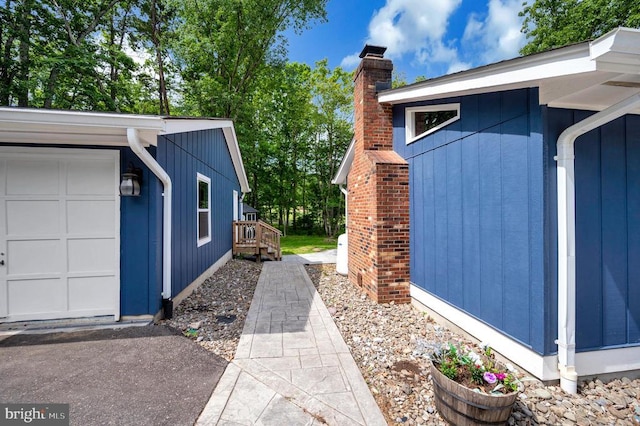 141 Eagle Ct, Locust Grove, VA 22508 - view of home's exterior featuring a chimney and a garage